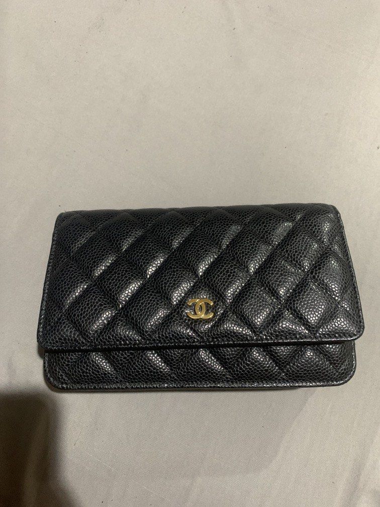 Chanel wallet on chain GHW CAVIAR FULL SET (Category: Luxury Bags & Wallets) located in Pasig City. Submitted by declutterapparel (Listing ID 1447534376, Image 2). Description: - Classic Chanel WOC - Black caviar leather - Gold hardware - Comes with original Chanel box, receipt, paper bag, dustbag, entrupy etc. - used - series 30. - dustbag damaged (peeling) & paper bag has stain or yellowing on the flower part Rfs: prefer bigger bags sure buyer 