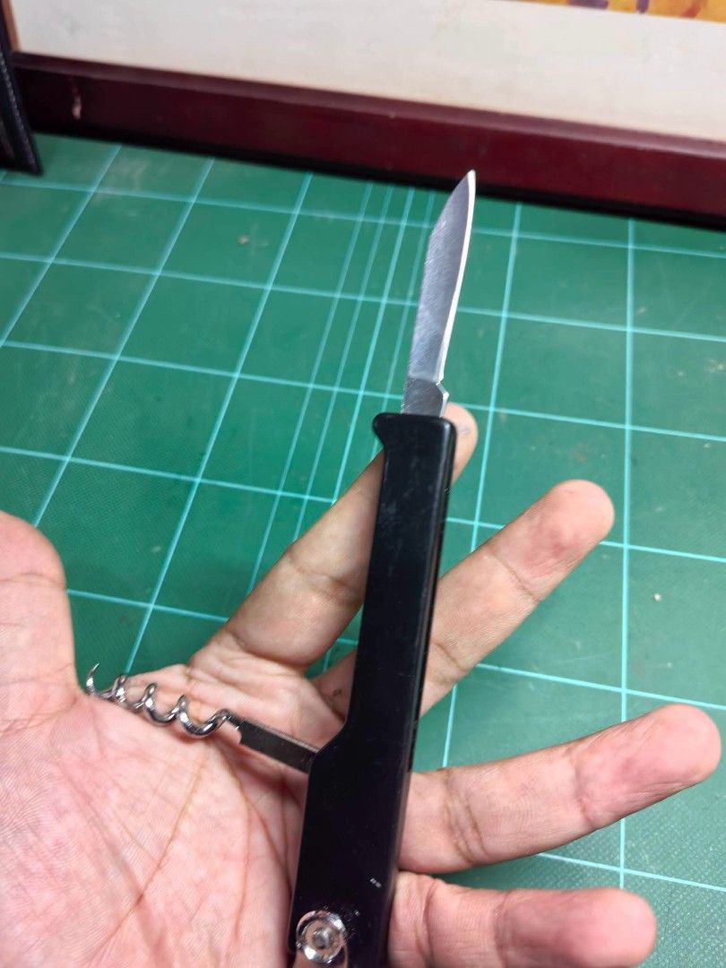 Classic Black-Handled Waiter's Corkscrew (Category: Other Kitchenware & Tableware) located in Cebu City. Submitted by dudes_villanueva (Listing ID 1456254076, Image 3). Description: Classic Black-Handled Waiter's Corkscrew 📌 Also known as a sommelier knife or wine key, featuring a folding pocket knife blade, a spiral corkscrew worm, and a bottle cap opener. 📌 In very good condition. Medyo loose Lang konti Yung bottle Opener. Not a big issue..