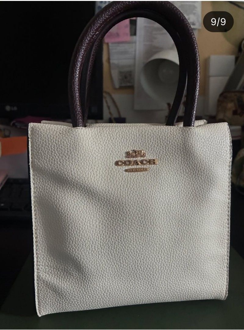 Coach Mini Cally Pebble Leather Hand Bag (Category: Luxury Bags & Wallets) located in Quezon City. Submitted by never_a_clutter (Listing ID 1456297528, Image 1). Description: - Brand: Coach - Material: White pebble leather - Handle color: Dark brown - Hardware: Gold Coach New York logo on front - Style: Classic everyday tote - Features: Plenty of interior space - FLAW: NO SLING - AUTHENTICITY NOT GUARANTEE.