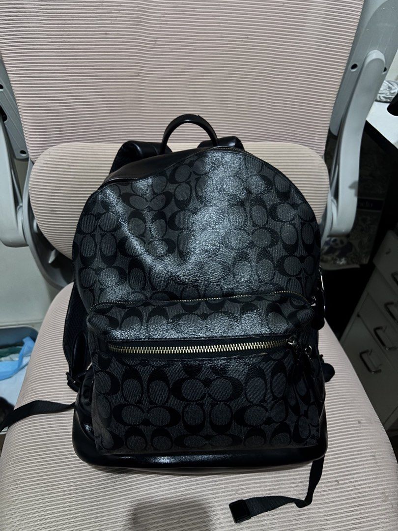 Coach Signature Monogram Backpack (Category: Luxury Bags & Wallets) located in Aroroy. Submitted by paldogs (Listing ID 1456373295, Image 1). Description: - Authentic Coach backpack in signature monogram print. - Stylish black and grey colorway. - Convenient front zip pocket for essentials. - Adjustable straps for a comfortable fit. - Breathable mesh panel on the back for added comfort. - Durable zippers with embossed Coach logo. - Premium leathe