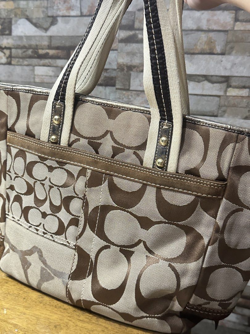 Coach Signature Patchwork Monogram Tote Bag (Category: Luxury Bags & Wallets) located in Manila. Submitted by keiscart_ (Listing ID 1456420912, Image 2). Description: - Classic Coach tote bag - Signature C monogram pattern - Brown and tan colorway - Genuine leather trim and handles - Secure zipper closure - Convenient front zipper pocket - Includes original Coach hang tag and charm - Ideal for everyday use.