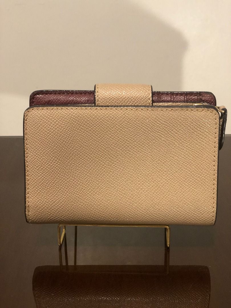 Coach Signature Taupe Medium Corner Zip Wallet (Category: Luxury Bags & Wallets) located in Rizal. Submitted by titapearlscloset (Listing ID 1449608698, Image 2). Description: ♡ Purchased from Japan ♡ Rank C | Well Used ♡ Brand: Coach ♡ Medium Corner Zip Wallet ♡ Color Taupe ♡ Size: Approx. H3.5 x W5.1 x Thickness 1.2 inches ♡ Material: Leather / Closure: Snap / Interior: Bill compartment x 1, Open pocket x 2, Card slot x 7, ID pocket x 1, Exteri