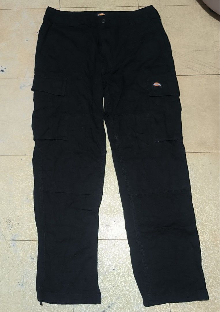 Dickies Double Patch Black Cargo Pant (Category: Jeans) located in Manila. Submitted by itsmelawrence (Listing ID 1456391143, Image 1). Description: - Brand: Dickies Double Patch - Color: Black 9.6/10 color rate - Sise 32-33 x 43 haba - Style: Cargo Pants (WT124BK) - Features: Multiple pockets for ample storage - Material: Durable fabric, built to last - Closure: Button waist - Details: Zippers at the ankle - Versatile: Ideal for workwear or casu