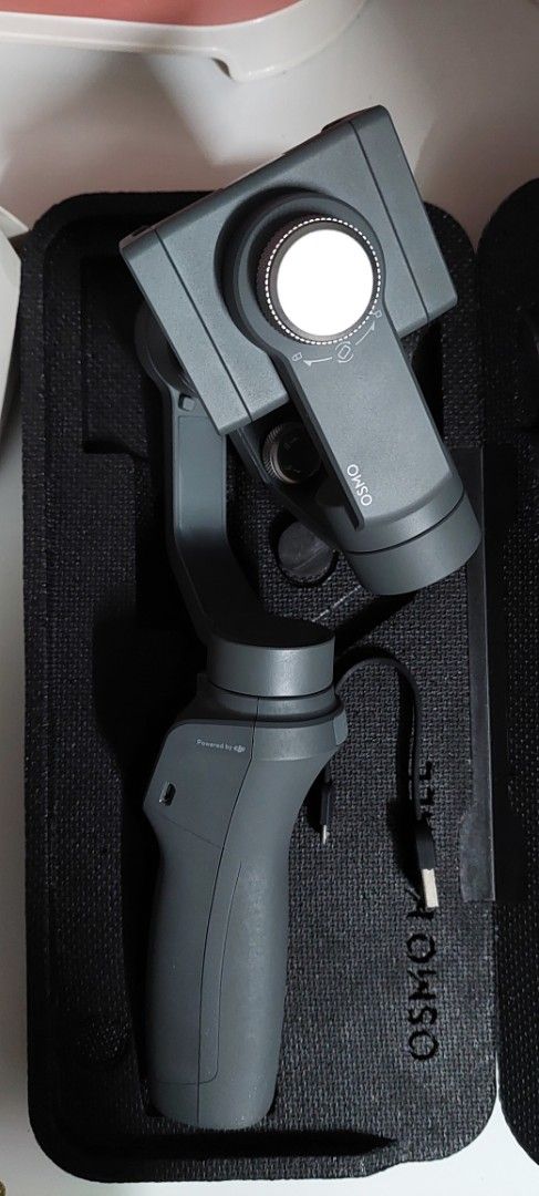 DJI Osmo Mobile 2 Gimbal Stabilizer with Case (Category: Gimbals & Stabilizers ) located in Taguig. Submitted by thrifthub.ph (Listing ID 1456304549, Image 3). Description: DJI Osmo Mobile 2 smartphone gimbal. Includes original box, protective case, and charging cable. Perfect for smooth videos. For Pick up Only. Loc.Taguig.