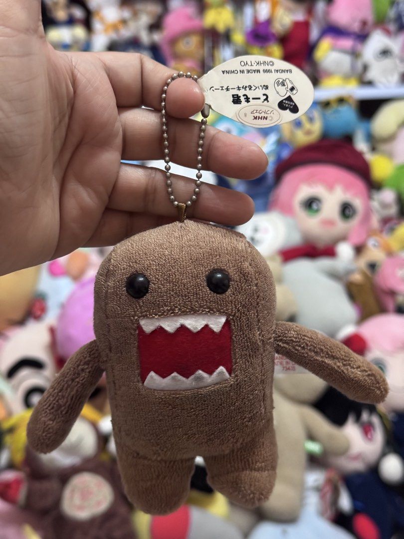 Domo-Kun plush charm (Category: Plushies & Soft Toys) located in Antipolo. Submitted by bhabiegraciefashionlab (Listing ID 1456253017, Image 2). Description: 480 ea or 1,800 set - 2pcs Vintage Domo kun charms, 1pc with papertag - 2pcs Vintage blue Digital Domo kun charms, 1pc with papertag.