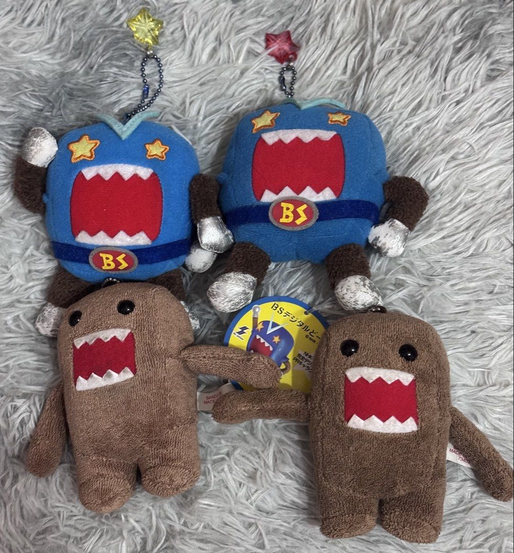 Domo-Kun plush charm (Category: Plushies & Soft Toys) located in Antipolo. Submitted by bhabiegraciefashionlab (Listing ID 1456253017, Image 1). Description: 480 ea or 1,800 set - 2pcs Vintage Domo kun charms, 1pc with papertag - 2pcs Vintage blue Digital Domo kun charms, 1pc with papertag.
