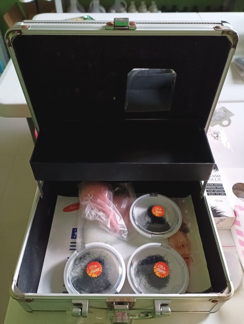 Eyelash Extension Kit with Glue, Lashes, Tools & Case (Category: Makeup) located in Manila. Submitted by iamwhilmz (Listing ID 1456270014, Image 2). Description: - Full eyelash extension kit - Includes lash clusters in various sizes (8mm, 12mm) - Comes with eyelash glue, applicator tools, scissors, and a brush - All organized in a silver carrying case - Some items still in original packaging - Ideal for personal use or professional makeup artists