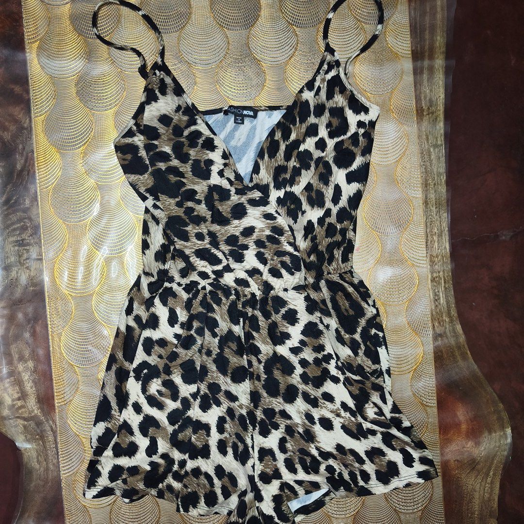 Fashion Nova Leopard Print Spaghetti Strap Romper (Category: Rompers) located in Manila. Submitted by swertecat (Listing ID 1456256033, Image 2). Description: - Fashion Nova leopard print romper - Flattering wrap front design - Delicate spaghetti straps - Lightweight and flowy fabric - Versatile for night out or casual wear - Pairs well with heels or sandals - Medium on tag Antipolo, Rizal.