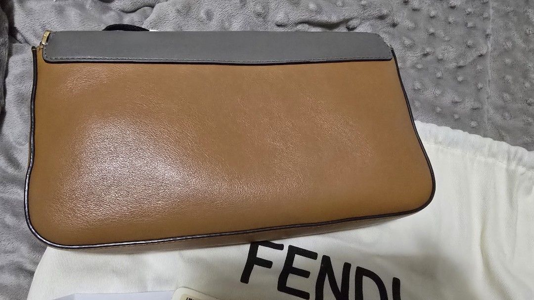 Fendi Baguette Bag with Strap (Category: Luxury Bags & Wallets) located in Las Pinas. Submitted by insouciant_worrier (Listing ID 1456411337, Image 3). Description: Take note: - bought from an online luxury bag reseller (instagram) - with authenticity card - some creasing (see images) - Slightly negotiable - RFS: decluttering - Authentic Fendi Baguette Bag with FF strap - Includes: Original dust bag, authenticity card, delivery receipt.