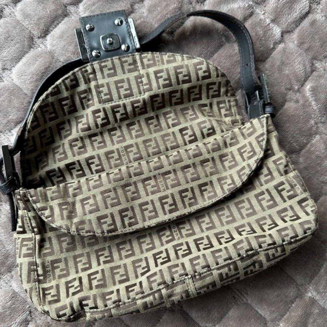 Fendi Baguette Mini in Brown (Category: Luxury Bags & Wallets) located in Las Pinas. Submitted by izanamico (Listing ID 1456385901, Image 2). Description: The iconic Fendi Baguette Bag in brown. In great condition. Minor flaws, the leather strap already has signs of aging and usage. Message me for more photos. Very pretty and light in person, thrifted in Korea for 20k in PHP. Has Fendi linings and brand notches on clasps and buttons, but no code.