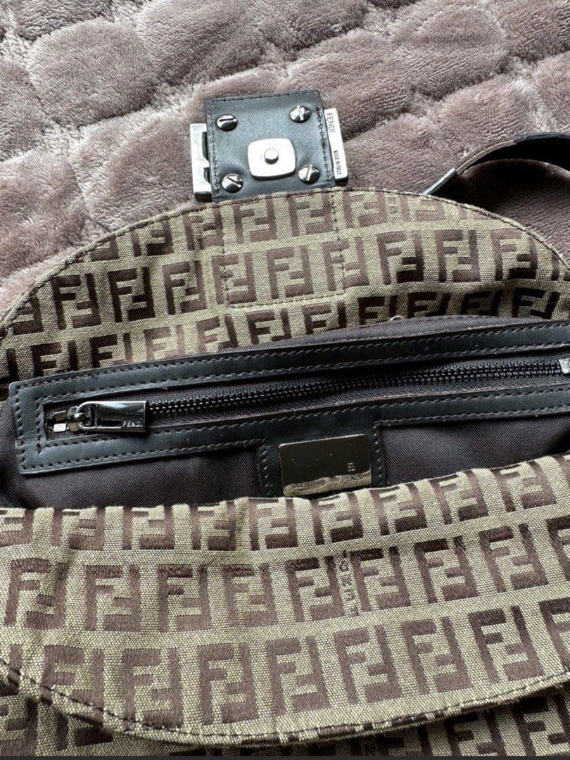 Fendi Baguette Mini in Brown (Category: Luxury Bags & Wallets) located in Las Pinas. Submitted by izanamico (Listing ID 1456385901, Image 3). Description: The iconic Fendi Baguette Bag in brown. In great condition. Minor flaws, the leather strap already has signs of aging and usage. Message me for more photos. Very pretty and light in person, thrifted in Korea for 20k in PHP. Has Fendi linings and brand notches on clasps and buttons, but no code.