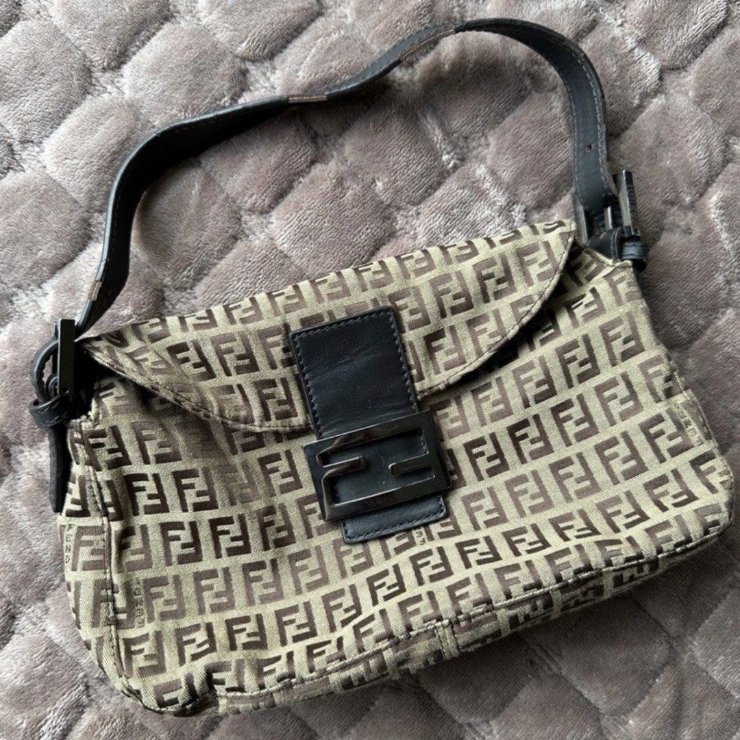Fendi Baguette Mini in Brown (Category: Luxury Bags & Wallets) located in Las Pinas. Submitted by izanamico (Listing ID 1456385901, Image 1). Description: The iconic Fendi Baguette Bag in brown. In great condition. Minor flaws, the leather strap already has signs of aging and usage. Message me for more photos. Very pretty and light in person, thrifted in Korea for 20k in PHP. Has Fendi linings and brand notches on clasps and buttons, but no code.