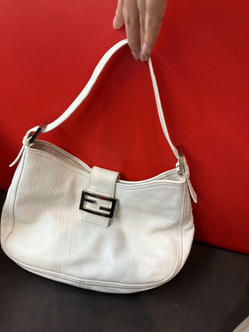 Fendi Cream Leather Baguette Bag (Category: Luxury Bags & Wallets) located in Pasig City. Submitted by miss_abuelita (Listing ID 1452670490, Image 1). Description: LIMITED EDITION RARE ITEM Authentic Cream Fendi Baguette Bag Comes with dustbag and coa Flaw: -has small stain on the back not seen when worn -signs of usage kn strap not visible much Rank: B/AB .