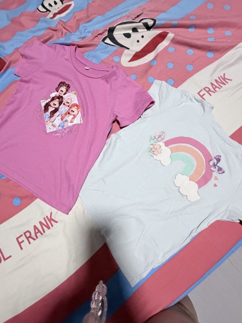 Girls' Pajama Set and Tops Bundle (Category: Babies & Kids Fashion) located in Manila. Submitted by kaths88 (Listing ID 1456368430, Image 3). Description: - Bundle of girls' sleepwear and tops. - Includes 2 pajama sets: - Pink with cartoon characters - Navy with floral print - Includes 3 t-shirts: - Pink with cartoon characters - Light blue with rainbow and butterfly - Magenta with parrot design - Versatile for sleep or casual wear. Take all.