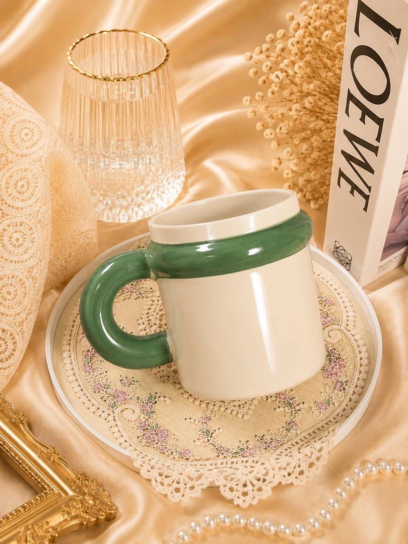 Green Cute Ceramic Mugs with Unique Handles (Category: Coffee & Tea Tableware) located in Caloocan City. Submitted by sujenzkiii (Listing ID 1456295034, Image 2). Description: 🧚‍♀️ PERFECT FOR EVERYDAY USE — Calling all girlies who love aesthetic finds, 3D mugs, cute mugs, and more! 💝 Styles available: 3D, Coquette, Plain & Aesthetic designs 🍵 Ceramic mugs imported from an international supplier — all brand new. Note: some pieces may have a sl