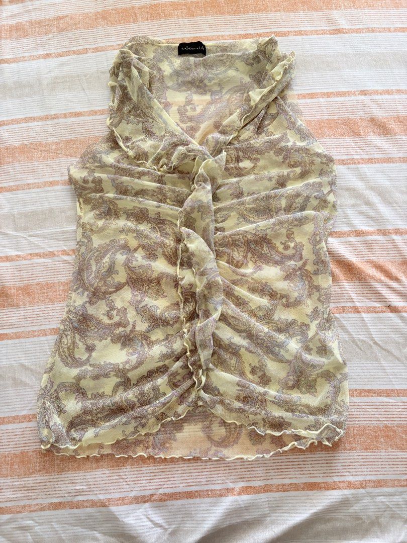 green sheer paisley top with ruffles (Category: Sleeveless) located in Bocaue. Submitted by cleodeclutters (Listing ID 1456257013, Image 1). Description: ☆ thrifted ☆ - originally a long sleeve top - manually cut the sleeve hence the uneven shape mop : gcash, maribank, bdo mod : j&t, lalamove message for more details & inquiries ➔ payment first ➔ strictly no return & refund.