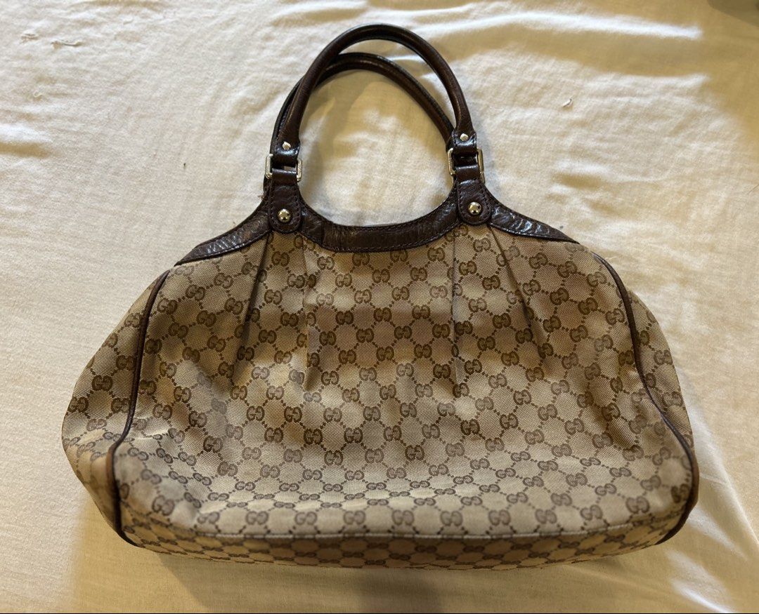 Authentic Gucci Sukey Tote Bag (Category: Luxury Bags & Wallets) located in San Jose del Monte. Submitted by declutteriri (Listing ID 1456294417, Image 2). Description: Text me for inquiries. I cant see Carousell messages. Brand: Gucci (Authentic) Style: Shoulder Bag / Tote / Hobo Material: GG Monogram Canvas with Brown Leather Trim and Handles Hardware: Gold-tone Features: Iconic interlocking GG canvas pattern Dual leather shoulder handles Disti