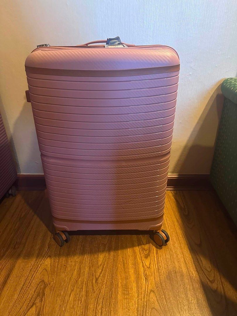 Hardcase Luggage - Pink and Purple (Category: Luggage) located in Mandaluyong City. Submitted by greenapple14 (Listing ID 1456351265, Image 1). Description: - Two hardcase luggages available: Dusty Rose Pink and Deep Purple. - Medium to large size, perfect for extended trips. - Textured exterior for added durability and style. - Smooth 4-spinner wheel system for easy maneuverability. - Ideal for your next adventure! - Option to purchase one or bo