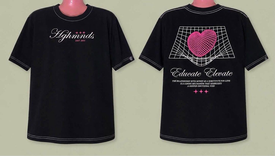 Hghmnds Black Graphic T-Shirt "Educate Elevate" (Category: Tshirts & Polo Shirts ) located in Las Pinas. Submitted by jewicka (Listing ID 1456316732, Image 1). Description: - Brand: Hghmnds (established 2011) - Color: Black - Design: 'Educate Elevate' graphic on back - Graphic Details: Pink heart, text about money and emotional voids - Stitching: White contrast stitching on neckline, sleeves, and hem - Style: Unique streetwear piece.