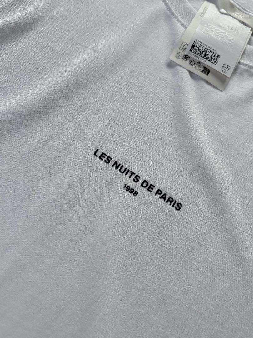 H&M White Long Sleeve "Les Nuits De Paris" (Category: Tshirts & Polo Shirts ) located in Manila. Submitted by izzmya (Listing ID 1456270279, Image 2). Description: - Brand: H&M - Color: White - Style: Long Sleeve - Graphic: "Les Nuits De Paris 1998" print on front - Neckline: Crew neck - Condition: Brand new with tags, but the tags are no longer attached - Material: Comfortable fabric It runs oversized Length: 28inch Width: 25inch.