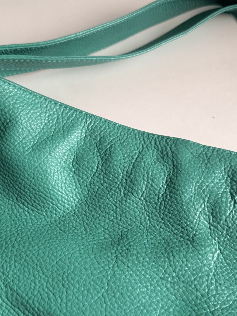 Italian Leather Two-Way Shoulder Bag (Category: Shoulder Bags) located in San Juan City. Submitted by maxiepie (Listing ID 1456316051, Image 2). Description: Like new and selling for more than 60% off. Features: - Retails for approximately $140 or P8,600 - Made by Italian artisans - Two ways to wear—as a shoulder bag or backpack - Soft, durable pebble grain leather - Zipper closure - Two interior pockets, one with zipper and one without - Approxi