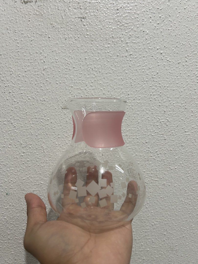 Iwaki Pyrex Glass Coffee Server with Pink Collar (Category: Coffee & Tea Tableware) located in Manila. Submitted by potchi.thrifts (Listing ID 1456397100, Image 2). Description: - Genuine Iwaki Pyrex glass coffee server - Features a stylish pink collar accent - Clear glass body with a subtle, elegant square pattern - Ideal for brewing your favorite coffee - Dishwasher safe for easy cleaning.