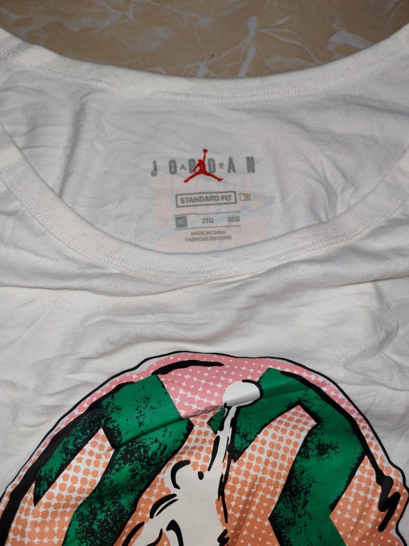 Jordan White Tank Top 3XL (Category: Sleeveless) located in Cotabato. Submitted by rayhan.thriftee (Listing ID 1456289343, Image 3). Description: - White Jordan tank top - Features iconic Jumpman logo with a colorful graphic - Size: 3XL - Material: 100% Cotton - Fit: Standard - Origin: Made in China - Ideal for: Casual wear, workouts, or everyday comfort.