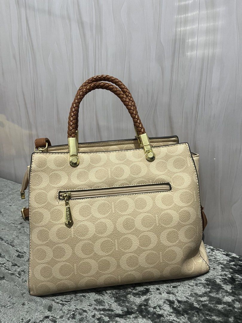 Jovanni brown hand/shoulder bag (Category: Luxury Bags & Wallets) located in Carles. Submitted by stefunnnny (Listing ID 1456317749, Image 2). Description: Jovanni old rose hand and/or shoulder bag bought for 2899 in SM Dept Store. Super bago pa. Issue: very small ball-pen stain sa zipper, and small chip sa handle (not noticeable) RFS: Decluttering my bags..