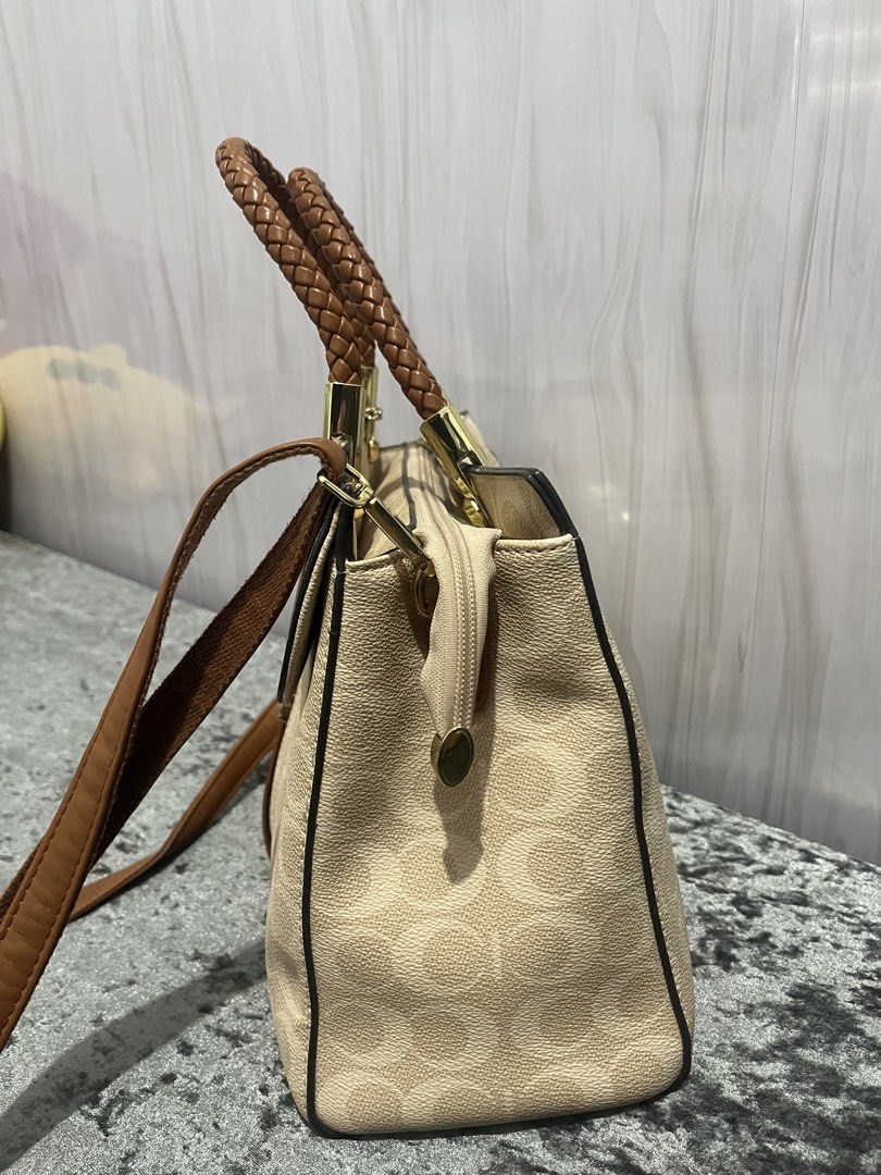 Jovanni brown hand/shoulder bag (Category: Luxury Bags & Wallets) located in Carles. Submitted by stefunnnny (Listing ID 1456317749, Image 3). Description: Jovanni old rose hand and/or shoulder bag bought for 2899 in SM Dept Store. Super bago pa. Issue: very small ball-pen stain sa zipper, and small chip sa handle (not noticeable) RFS: Decluttering my bags..