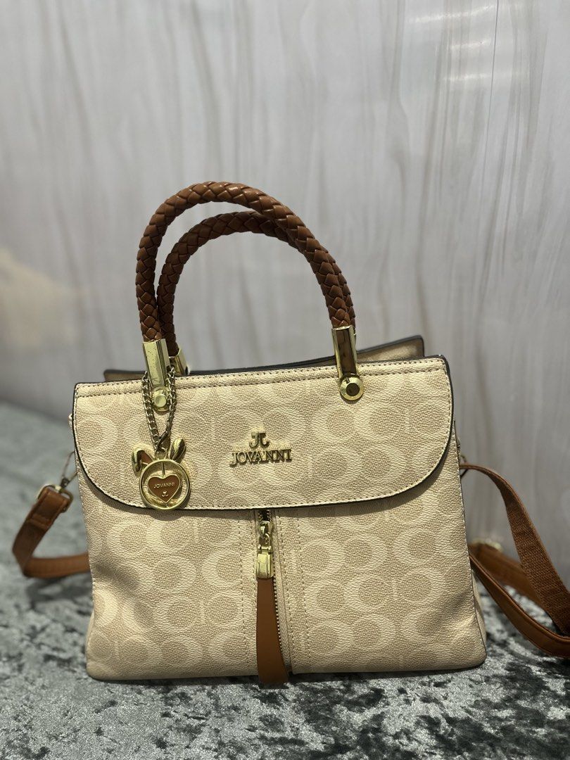 Jovanni brown hand/shoulder bag (Category: Luxury Bags & Wallets) located in Carles. Submitted by stefunnnny (Listing ID 1456317749, Image 1). Description: Jovanni old rose hand and/or shoulder bag bought for 2899 in SM Dept Store. Super bago pa. Issue: very small ball-pen stain sa zipper, and small chip sa handle (not noticeable) RFS: Decluttering my bags..