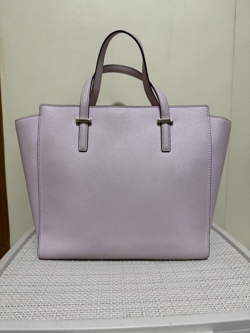Kate Spade Hayden Tote Bag - large (Category: Luxury Bags & Wallets) located in Las Pinas. Submitted by mari.santos. (Listing ID 1456336967, Image 2). Description: - Light pink Kate Spade tote bag - Saffiano leather material - Elegant gold hardware details - Secure zipper closure on top - Four metal feet for protection - Comfortable, well-sized handles - Generously spacious interior - comes with long strap and original dust bag.