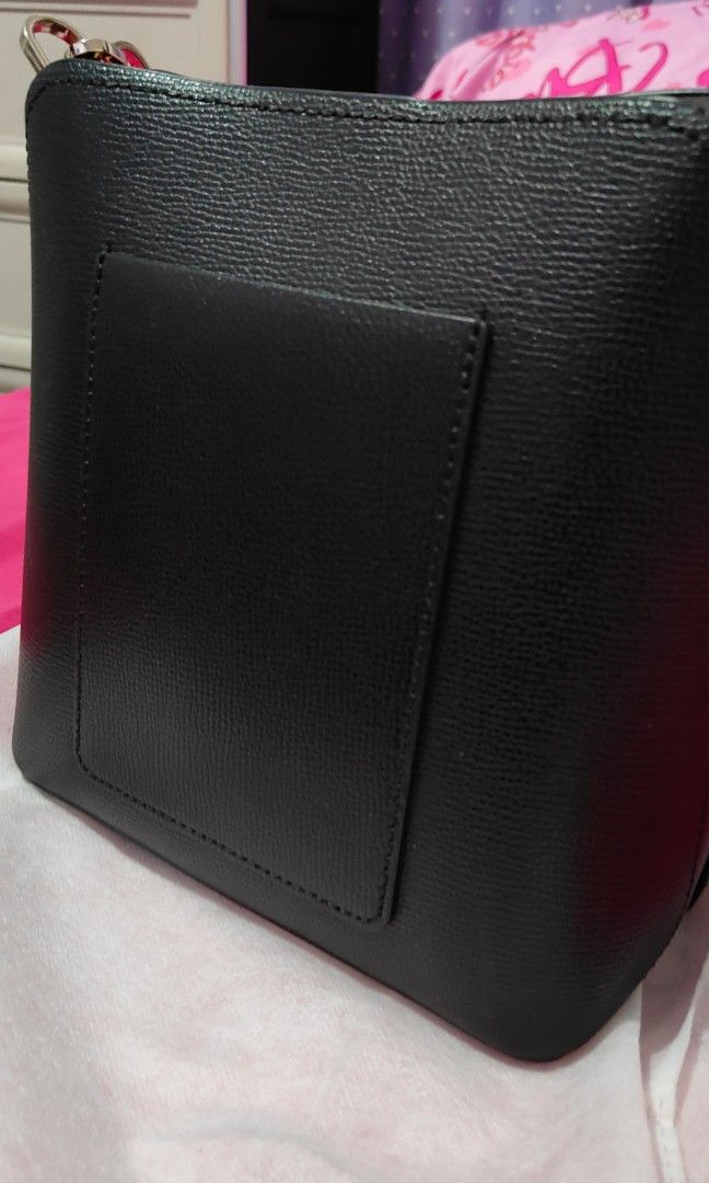 Kate Spade Small Bucket Bag with Strap (Category: Luxury Bags & Wallets) located in Bacolor. Submitted by annjjjjj (Listing ID 1456290362, Image 2). Description: - Authentic Kate Spade New York bucket bag - Classic black pebbled leather - Gold hardware details - Detachable crossbody strap included - Spacious interior for all your essentials - Versatile for daily use or dressing up.