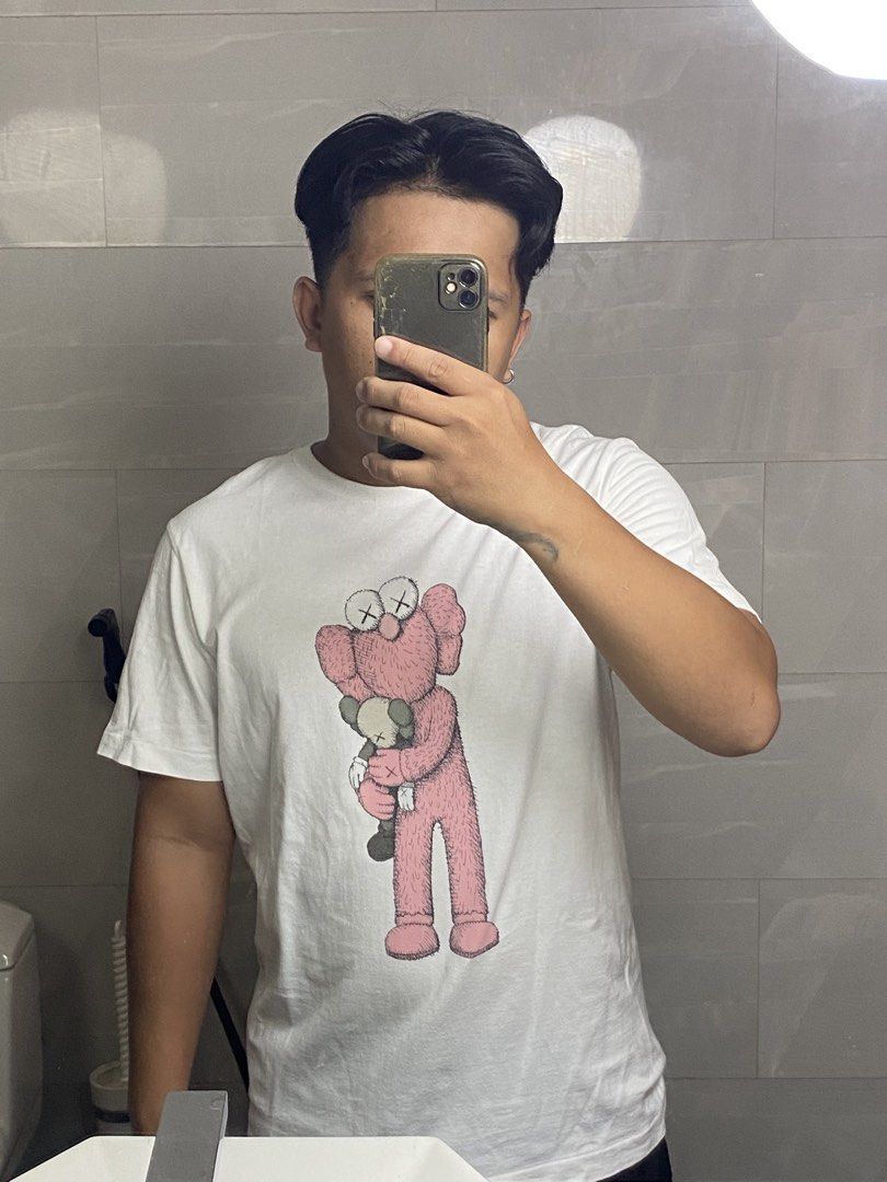 Kaws X Uniqlo Tshirt (Category: Tshirts & Polo Shirts ) located in Digos. Submitted by thriftflexph (Listing ID 1456348290, Image 2). Description: Size&Dimes:20/28 Color&Condi:9/10 issue:Last pic Pero sobrang puti pa. DM for more information 🫶 Items are all thrifted/Handpicked Can ship nationwide🇵🇭 Add Shipping Fee ✈️🎁.