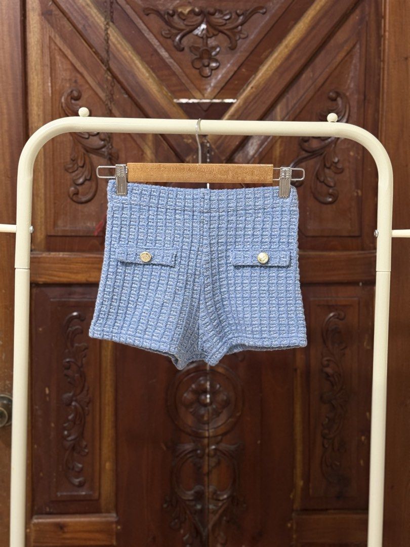 Light Blue Tweed Shorts with Gold Buttons (Category: Shorts) located in Iloilo. Submitted by wornwellco (Listing ID 1456300813, Image 1). Description: - Cute light blue tweed shorts - Features two gold button pockets on the front - Textured fabric for a unique look - Perfect for both casual and dressy occasions - Easy to pair with various tops.