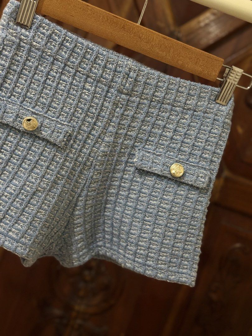 Light Blue Tweed Shorts with Gold Buttons (Category: Shorts) located in Iloilo. Submitted by wornwellco (Listing ID 1456300813, Image 2). Description: - Cute light blue tweed shorts - Features two gold button pockets on the front - Textured fabric for a unique look - Perfect for both casual and dressy occasions - Easy to pair with various tops.