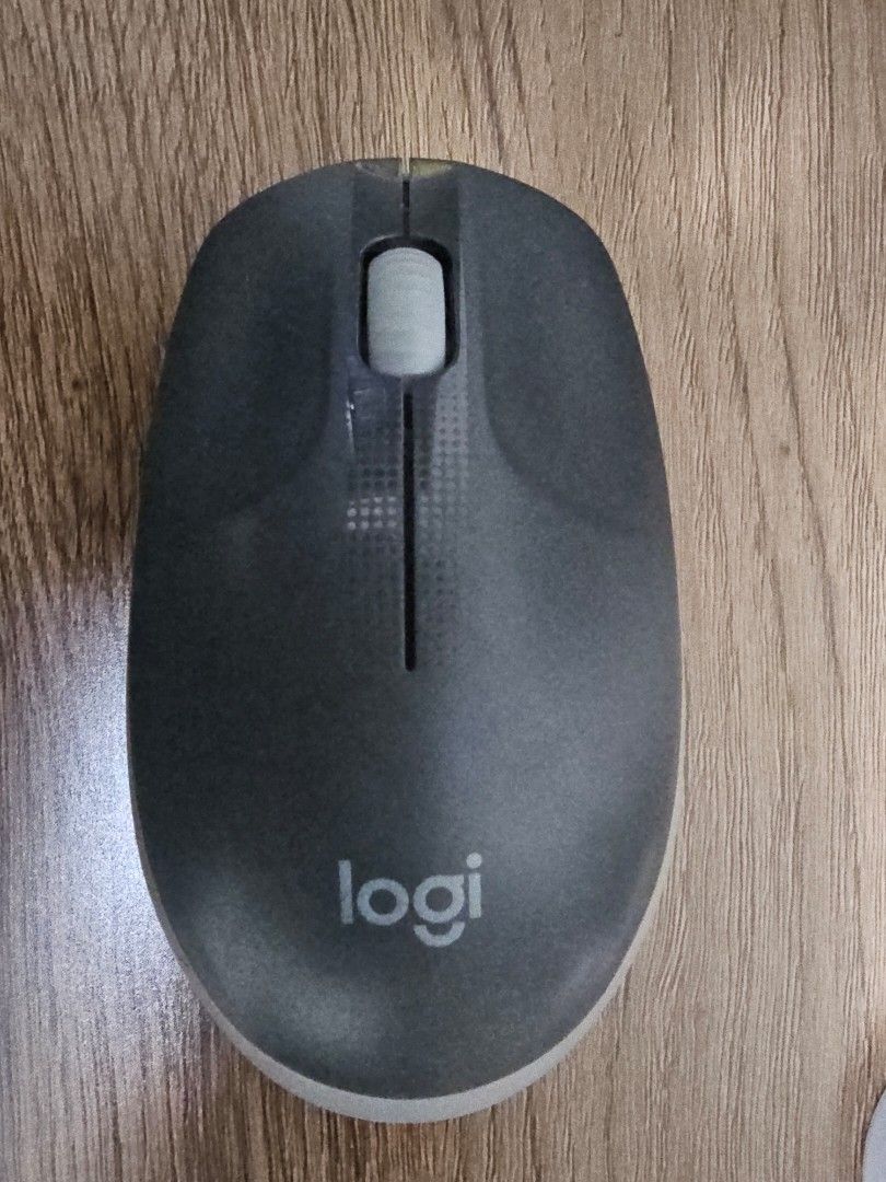 Logitech Wireless Mouse (Category: Mouse & Mousepads) located in Singapore. Submitted by randomsel (Listing ID 1456340299, Image 1). Description: - Logitech wireless mouse - Color: Dark grey with light grey base and scroll wheel - Condition: Works ok, some times might be glitchy - Ideal for: Everyday use.