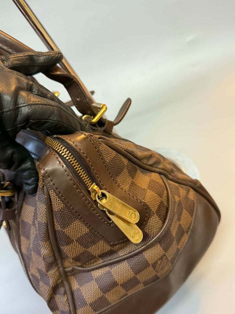 Louis Vuitton Damier Canvas (Category: Luxury Bags & Wallets) located in Caloocan City. Submitted by refreshmycloset444 (Listing ID 1456302852, Image 2). Description: - Authentic Louis Vuitton - Damier Ebene Canvas with classic checkered pattern - Brown leather trim and handles - Gold-tone hardware - Red interior lining with pockets - Secure zipper closure - A timeless and iconic LV handbag.