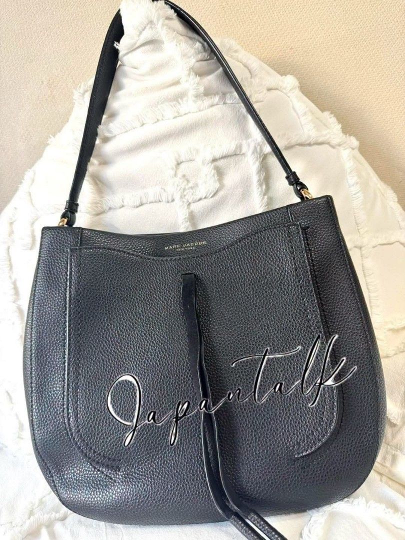 Marc Jacobs Black Leather Hobo Shoulder Bag (Category: Luxury Bags & Wallets) located in Bulacan. Submitted by vintage_purge (Listing ID 1456274165, Image 1). Description: - Authentic Marc Jacobs hobo bag - Color: Black - Material: Pebbled leather - Strap: Single shoulder strap - Features: Front flap pocket with tassel detail - Interior: Spacious, great for daily essentials - Style: Versatile everyday bag.