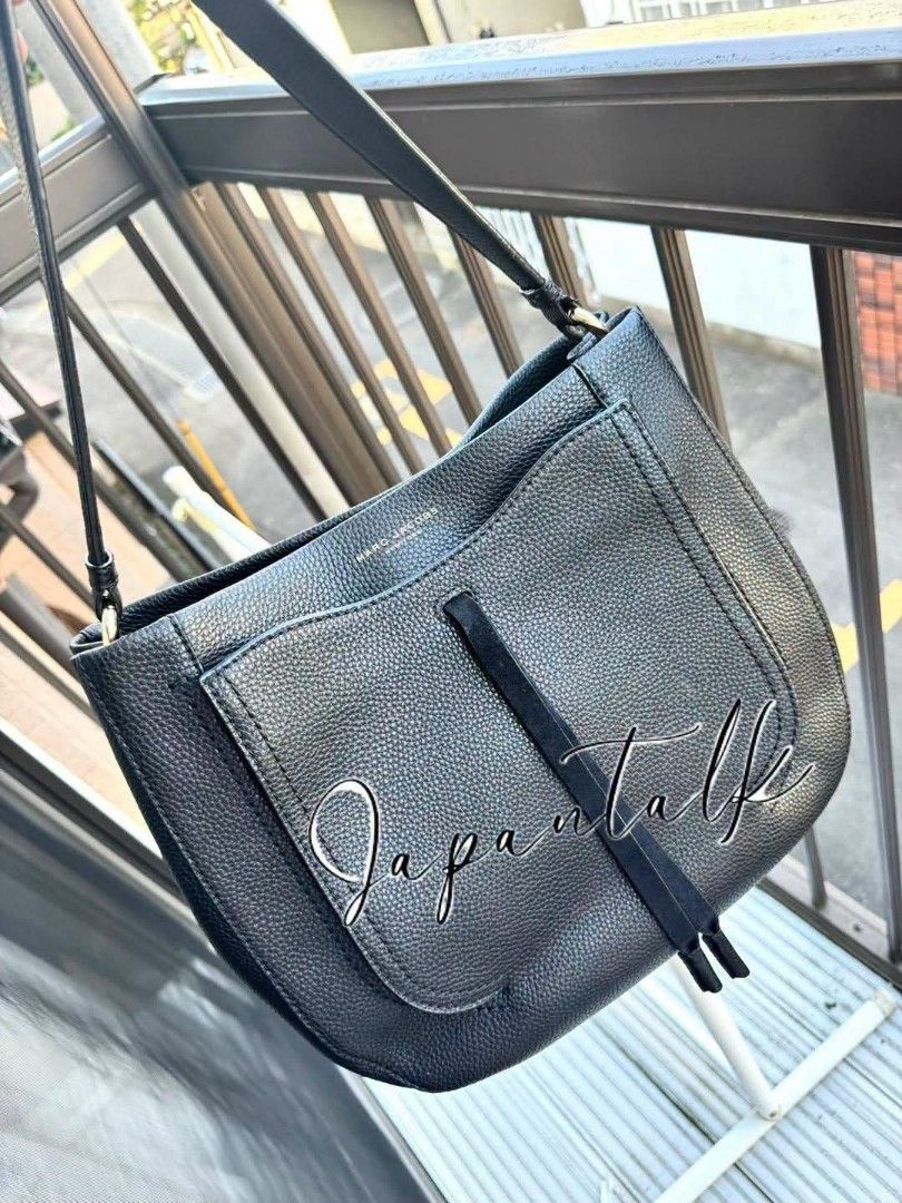 Marc Jacobs Black Leather Hobo Shoulder Bag (Category: Luxury Bags & Wallets) located in Bulacan. Submitted by vintage_purge (Listing ID 1456274165, Image 2). Description: - Authentic Marc Jacobs hobo bag - Color: Black - Material: Pebbled leather - Strap: Single shoulder strap - Features: Front flap pocket with tassel detail - Interior: Spacious, great for daily essentials - Style: Versatile everyday bag.