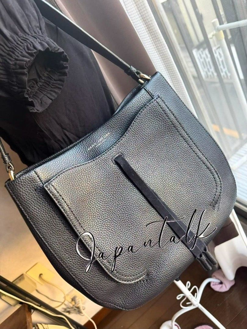 Marc Jacobs Black Leather Hobo Shoulder Bag (Category: Luxury Bags & Wallets) located in Bulacan. Submitted by vintage_purge (Listing ID 1456274165, Image 3). Description: - Authentic Marc Jacobs hobo bag - Color: Black - Material: Pebbled leather - Strap: Single shoulder strap - Features: Front flap pocket with tassel detail - Interior: Spacious, great for daily essentials - Style: Versatile everyday bag.