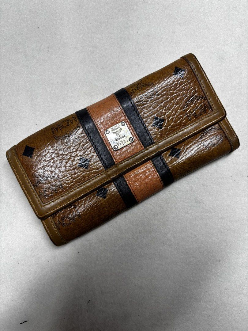 MCM Wallet Brown Monogram Trifold (Category: Luxury Bags & Wallets) located in Manila. Submitted by jeromskito66462 (Listing ID 1456347853, Image 3). Description: - Authentic MCM trifold wallet - Classic MCM monogram pattern - Multiple interior card slots - Clear ID window - Plenty of life left.