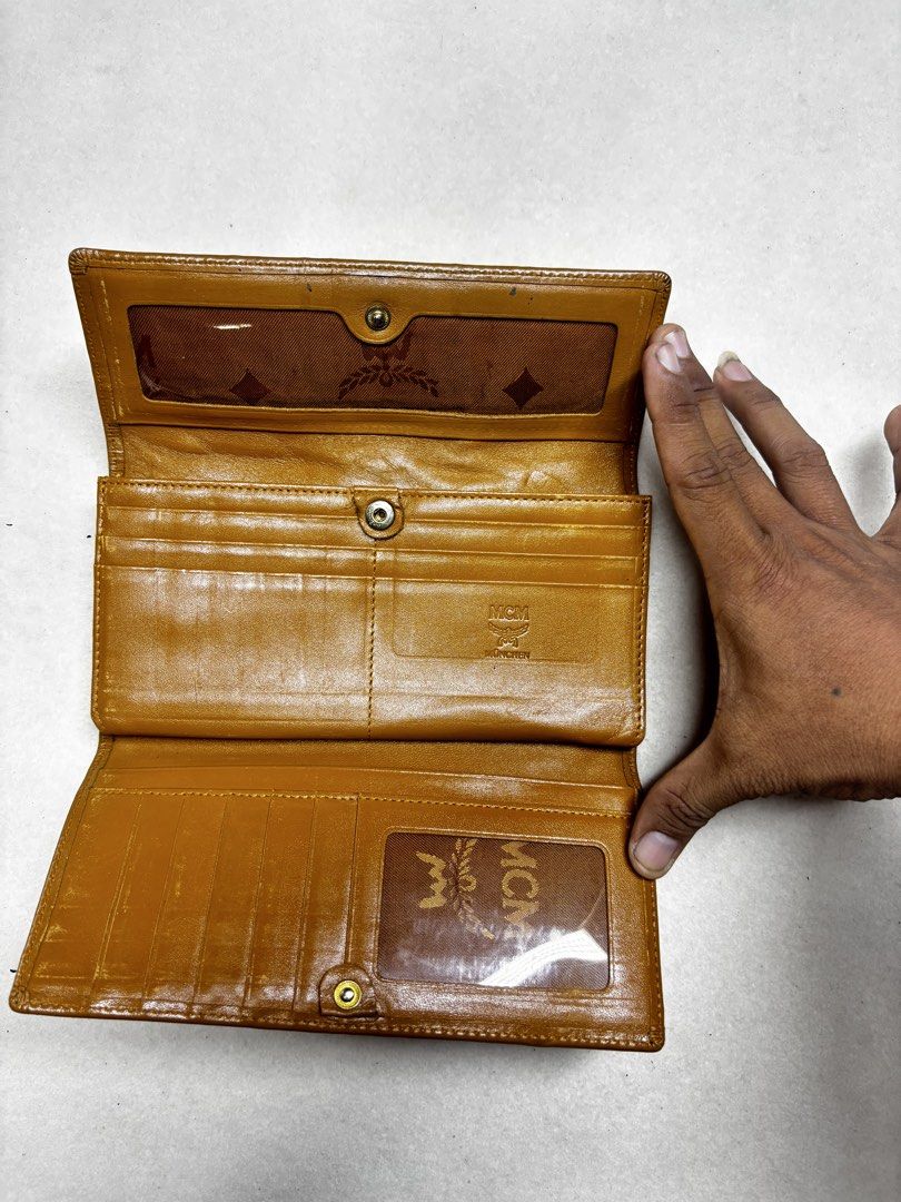 MCM Wallet Brown Monogram Trifold (Category: Luxury Bags & Wallets) located in Manila. Submitted by jeromskito66462 (Listing ID 1456347853, Image 1). Description: - Authentic MCM trifold wallet - Classic MCM monogram pattern - Multiple interior card slots - Clear ID window - Plenty of life left.