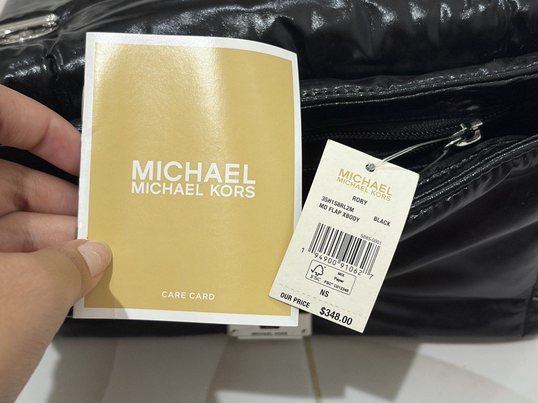 Michael Kors Rory Black Puffer Shoulder Bag (Category: Luxury Bags & Wallets) located in Quezon City. Submitted by sparklingberry (Listing ID 1456404044, Image 3). Description: - Original from US - Used 1-2 times only - Comes with original tag and care card - Black Michael Kors Rory bag - Shiny puffer material - Silver hardware - Interior zip pocket and logo lining - Versatile for everyday or nights out - Bought for around 19k selling for 15k (ne