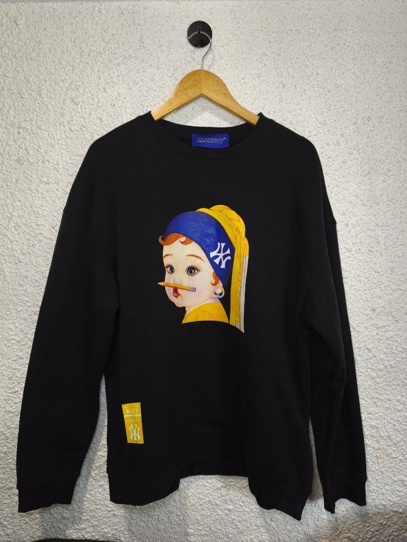 MLB BIGCT Bear Graphic Sweatshirt Black (Category: Coats, Jackets and Outerwear) located in Iloilo. Submitted by daddy_declutter (Listing ID 1456283260, Image 1). Description: Dimes: L 28 x W 25 Cool black sweatshirt with a unique graphic print: a baby with a pencil in its mouth, inspired by 'Girl with a Pearl Earring'. Features a blue headband with a logo and a yellow 'BIGCT BEAR' tag. Crew neck, long sleeves. Perfect for casual outfits..