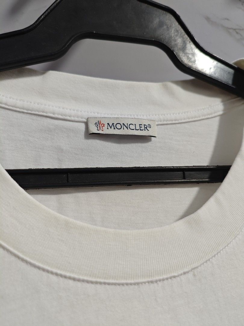 Moncler White Classic Unisex Tshirt (Category: Luxury Apparel) located in Baguio. Submitted by cool_chic (Listing ID 1456345959, Image 2). Description: Moncler White Classic Unisex Tshirt Color Rate 9.5/10 Like New Complete Tags Makapal Tela Machine Washed Size Medium Dimes 20 Width 28 Length Price P899.