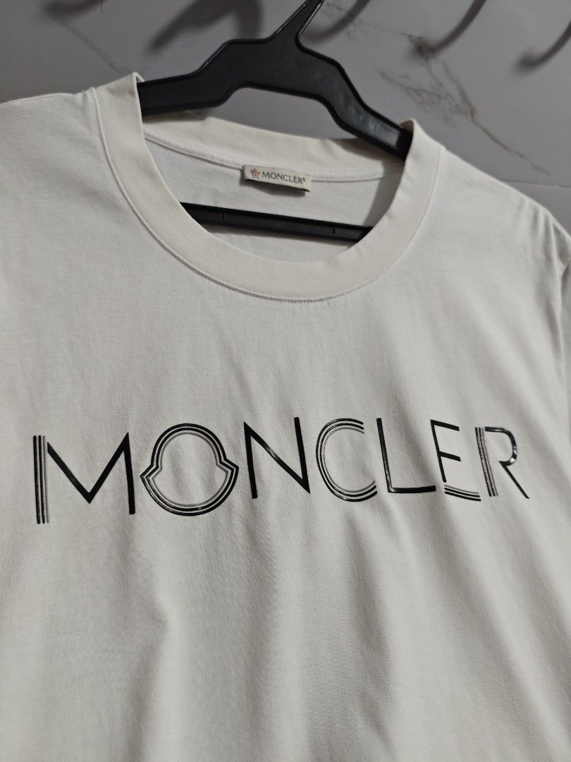 Moncler White Classic Unisex Tshirt (Category: Luxury Apparel) located in Baguio. Submitted by cool_chic (Listing ID 1456345959, Image 3). Description: Moncler White Classic Unisex Tshirt Color Rate 9.5/10 Like New Complete Tags Makapal Tela Machine Washed Size Medium Dimes 20 Width 28 Length Price P899.