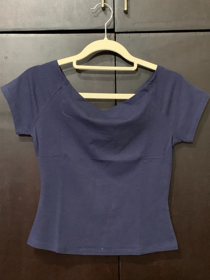 Navy Blue Off-Shoulder Short Sleeve Top (Category: Blouses) located in Binan City. Submitted by lviray (Listing ID 1456260864, Image 1). Description: - Navy blue top - Wide neckline - Short sleeves - Fitted waist - Comfortable fabric - Versatile: great for casual wear or dressing up.