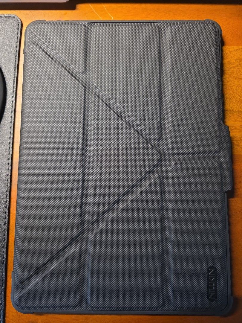 Nillkin S10 FE Cover case Black (Category: Cases & Sleeves) located in Marilao. Submitted by royalwind.7829fd (Listing ID 1456260589, Image 1). Description: - Brand: Nillkin - Model: S10 FE Cover Case - Color: Black - Features a unique geometric textured design on the exterior. - Provides reliable protection for your tablet. - Designed for functionality and ease of use..