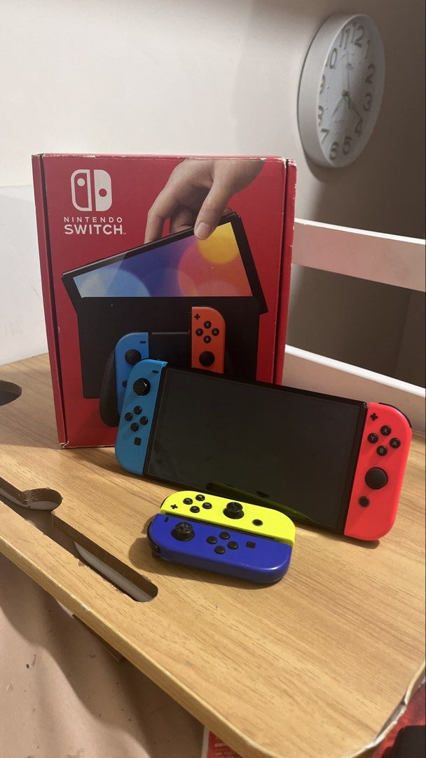 Nintendo Switch OLED with 2 Joycons and Game (Category: Nintendo) located in Manila. Submitted by florencetechsolutionsph (Listing ID 1456350133, Image 2). Description: Negotiable - Nintendo Switch OLED - Original Box Included - Just Dance 2022 (or EA FC) - With case for switch - Extra Yellow & Blue Joycons RFS: Di na ginagamit .