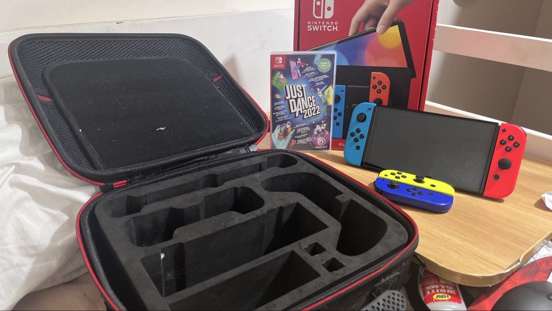 Nintendo Switch OLED with 2 Joycons and Game (Category: Nintendo) located in Manila. Submitted by florencetechsolutionsph (Listing ID 1456350133, Image 3). Description: Negotiable - Nintendo Switch OLED - Original Box Included - Just Dance 2022 (or EA FC) - With case for switch - Extra Yellow & Blue Joycons RFS: Di na ginagamit .